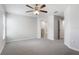 Bedroom with carpet, ceiling fan, and view to a bathroom at 257 Fig Ct, Kissimmee, FL 34759