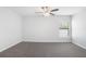 Carpeted bedroom featuring a ceiling fan, and a window at 257 Fig Ct, Kissimmee, FL 34759