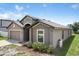 Attractive single-Gathering home with a long driveway and manicured landscaping at 257 Fig Ct, Kissimmee, FL 34759