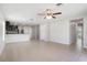 Open-concept living area with tile flooring flowing into the kitchen at 257 Fig Ct, Kissimmee, FL 34759