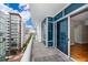 A condo balcony with a view of the neighborhood with gray floor and a partial view of the living space at 260 S Osceola Ave # 710, Orlando, FL 32801