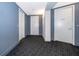 View of apartment hallway with doors leading to units and patterned carpet at 260 S Osceola Ave # 710, Orlando, FL 32801