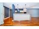 Open concept kitchen with large island, stainless steel appliances, and wood floors at 260 S Osceola Ave # 710, Orlando, FL 32801