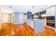 Modern open-concept kitchen with island, stainless appliances, and ample cabinet space at 260 S Osceola Ave # 710, Orlando, FL 32801