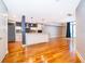 Modern kitchen with stainless steel appliances, island and wood floors at 260 S Osceola Ave # 710, Orlando, FL 32801