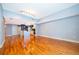 Bright, open-concept living room with gleaming hardwood floors and recessed lighting; perfect for entertaining at 260 S Osceola Ave # 710, Orlando, FL 32801