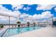 Stunning rooftop pool with lounge chairs and palm trees, offering a luxurious relaxation space at 260 S Osceola Ave # 710, Orlando, FL 32801