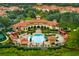 Beautiful aerial shot showcasing the community clubhouse, pool, and meticulously landscaped grounds at 2704 Lobelia Dr, Lake Mary, FL 32746