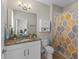Bright bathroom featuring granite countertops, white cabinetry, and shower with decorative curtain at 2704 Lobelia Dr, Lake Mary, FL 32746