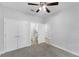 Carpeted bedroom with large closets and ensuite bathroom at 2704 Lobelia Dr, Lake Mary, FL 32746
