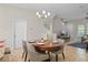 Dining area with a round table, seating for four and views into the living room and staircase at 2704 Lobelia Dr, Lake Mary, FL 32746