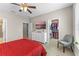 Comfortable bedroom with a walk-in closet, television, and an en-suite bathroom for added privacy at 2704 Lobelia Dr, Lake Mary, FL 32746