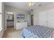 Relaxing bedroom features neutral walls, ceiling fan, closet, TV, and ensuite bathroom at 2704 Lobelia Dr, Lake Mary, FL 32746
