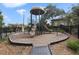 Community playground with modern equipment and a secure fenced area, perfect for outdoor activities at 2704 Lobelia Dr, Lake Mary, FL 32746