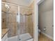 Stylish tiled shower with a glass door and a separate toilet area for added convenience at 2704 Lobelia Dr, Lake Mary, FL 32746