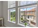 Picturesque view of neighborhood homes from large windows, bringing the outdoors in with natural light at 2704 Lobelia Dr, Lake Mary, FL 32746