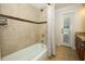 Bathroom featuring a tiled shower and bath combo, and granite countertops at 300 Royal Palm Ct, Longwood, FL 32779
