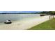 Private beach with a jet ski parked on the sand at 300 Royal Palm Ct, Longwood, FL 32779