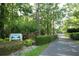 Welcome to Riverbend Park, a charming neighborhood entrance with lush landscaping and a serene atmosphere at 300 Royal Palm Ct, Longwood, FL 32779