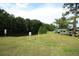 Lawn leading to a community waterfront and kayak storage at 300 Royal Palm Ct, Longwood, FL 32779