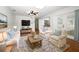 Inviting living room with ample natural light, a ceiling fan, and comfortable seating at 300 Royal Palm Ct, Longwood, FL 32779