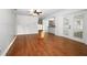 Open living room showcasing hardwood floors and a clear view of kitchen at 300 Royal Palm Ct, Longwood, FL 32779