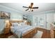 Main bedroom with light blue walls, hardwood floors, and an inviting, cozy ambiance at 300 Royal Palm Ct, Longwood, FL 32779