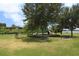 Community playground area with slides and benches by the lake at 300 Royal Palm Ct, Longwood, FL 32779