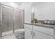 Bathroom features a tiled walk-in shower, a toilet, and a vanity sink at 3123 Camden Way, Davenport, FL 33837
