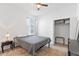 Bedroom features a window, a ceiling fan, and carpet flooring at 3123 Camden Way, Davenport, FL 33837