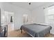 Bedroom with carpet flooring, a window, and a view to the hallway and bathroom at 3123 Camden Way, Davenport, FL 33837