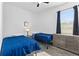 Bedroom with two twin beds, carpet, a window, and a dresser with plenty of storage at 3123 Camden Way, Davenport, FL 33837