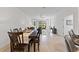 The dining room leads to the living room with a view to the lanai at 3123 Camden Way, Davenport, FL 33837