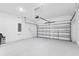 Clean and spacious two-car garage with an automatic door and ample room for parking and storage at 3123 Camden Way, Davenport, FL 33837