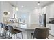 Bright kitchen with a large center island, stainless steel appliances, and ample counter space at 3123 Camden Way, Davenport, FL 33837