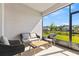 Covered lanai with patio furniture and a view of the backyard and neighboring houses at 3123 Camden Way, Davenport, FL 33837