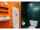 Unique bathroom design features an orange wall with a standing shower at 3511 Superior Ct, Orlando, FL 32810