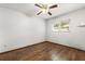 Cozy bedroom with wood floors, bright window, and neutral walls at 3511 Superior Ct, Orlando, FL 32810