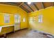 Bonus room has shelving, natural light, yellow walls, and a built in desk at 3511 Superior Ct, Orlando, FL 32810