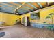 Large bonus room with tile floors, mural, and stainless steel fridge at 3511 Superior Ct, Orlando, FL 32810