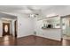Dining area open to kitchen, featuring hardwood floors and natural light at 3511 Superior Ct, Orlando, FL 32810