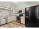 Functional kitchen featuring modern appliances, laminate countertops and tile flooring at 3511 Superior Ct, Orlando, FL 32810