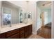 Bathroom featuring a double vanity and a separate room with a shower and tub at 3753 Heirloom Rose Pl, Oviedo, FL 32766
