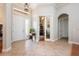 Grand foyer with tile flooring, a decorative pendant light, and a view into other rooms at 3753 Heirloom Rose Pl, Oviedo, FL 32766