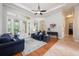 Comfortable living room with vaulted ceilings and access to outdoor patio at 3753 Heirloom Rose Pl, Oviedo, FL 32766