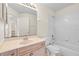 Bathroom features vanity with storage, an ample mirror, and a shower-tub combination at 40 Hollow Pine Dr, Debary, FL 32713