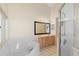 Bright bathroom with a walk-in shower, soaking tub, and double vanity at 40 Hollow Pine Dr, Debary, FL 32713