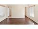 Bright bedroom boasts dark wood floors, light walls, and natural light from two windows at 40 Hollow Pine Dr, Debary, FL 32713