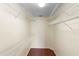 Walk-in closet with wood flooring and wire shelving for ample storage at 40 Hollow Pine Dr, Debary, FL 32713