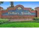 Brick entrance to the DeBary Woods community with lush green landscaping at 40 Hollow Pine Dr, Debary, FL 32713